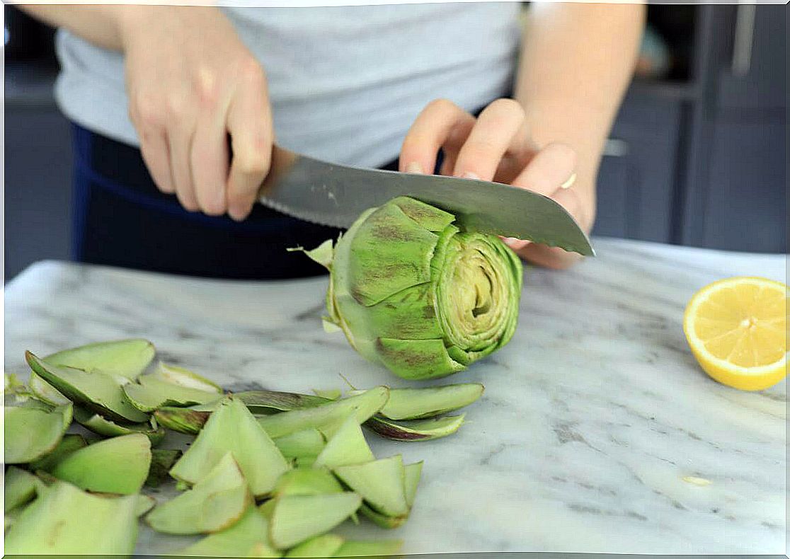 Man splitting an artichoke