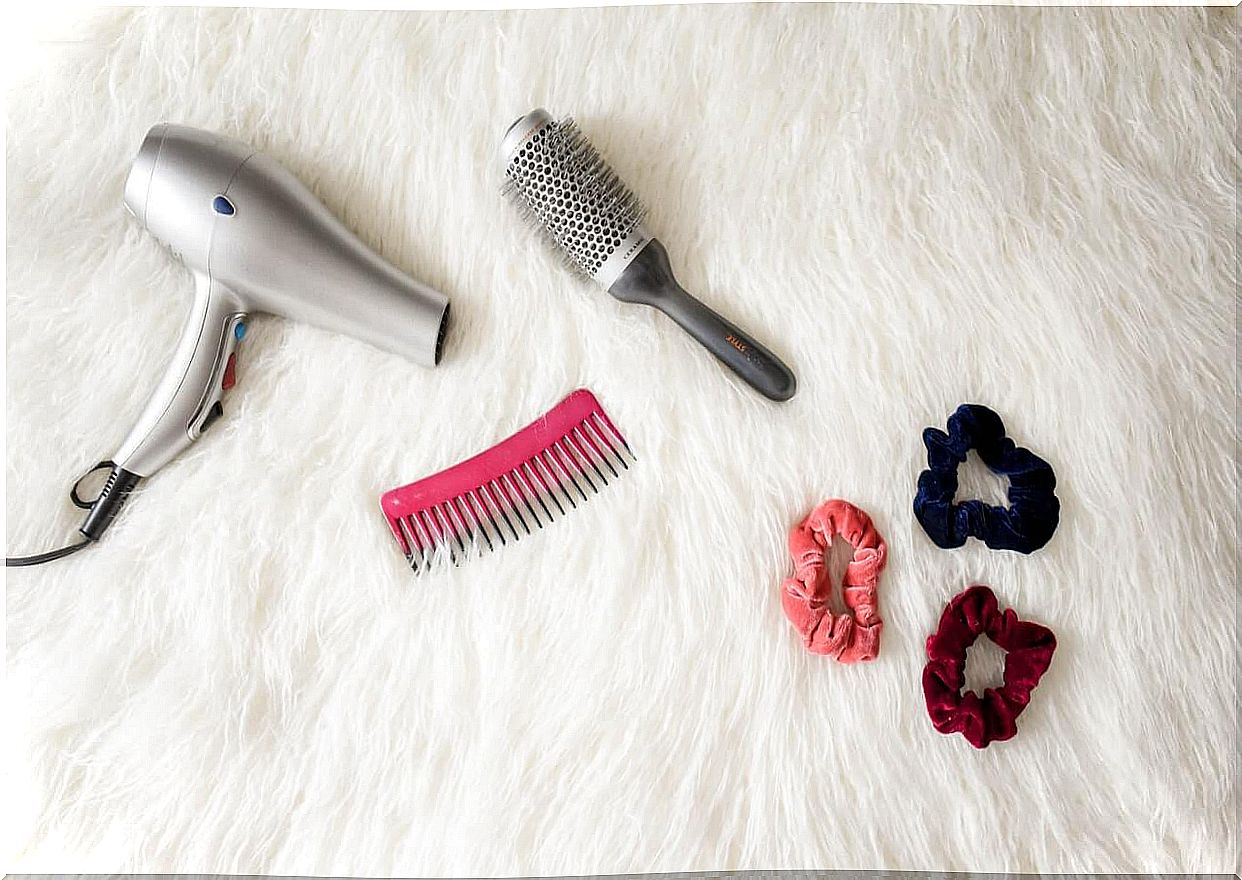 Hair dryer, brush and pigtails.