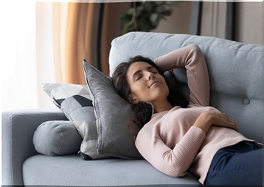 Woman taking nap on the couch.