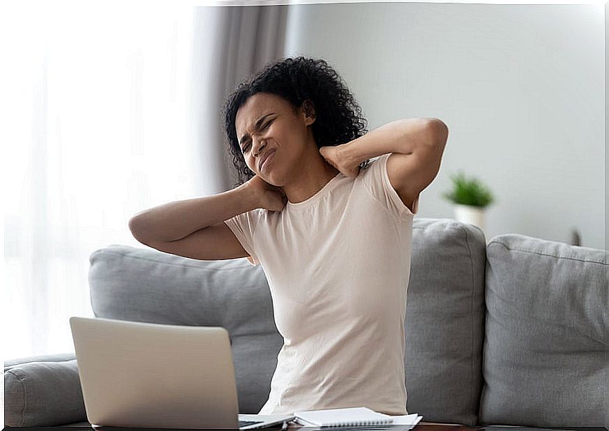 Girl with neck pain from using the laptop a lot.