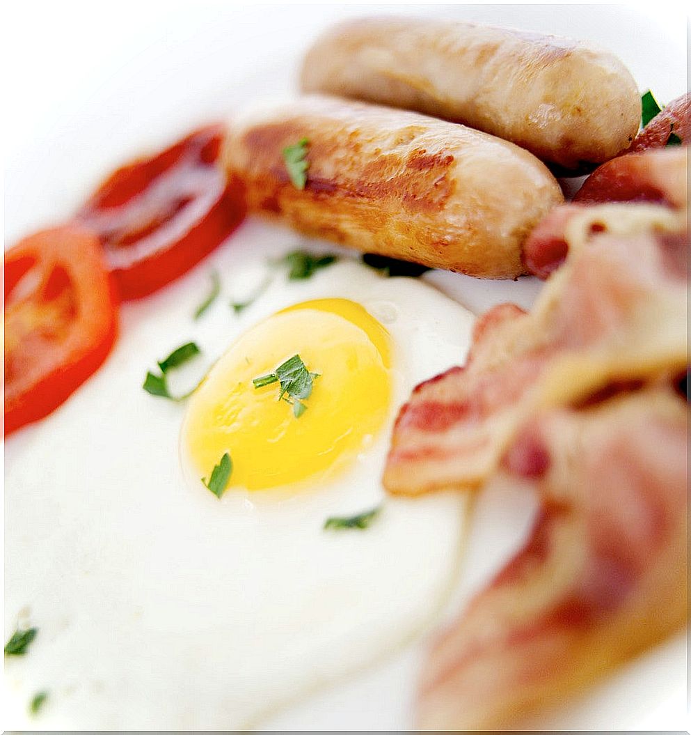 Fried Eggs Bacon and Sausages on a Plate