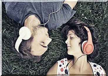 Couple listening to music with headphones