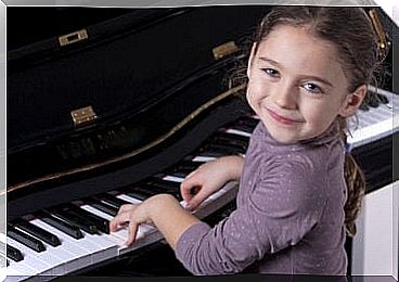 Little girl playing the piano