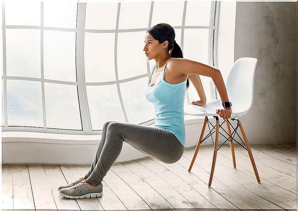 Girl exercising on the chair.